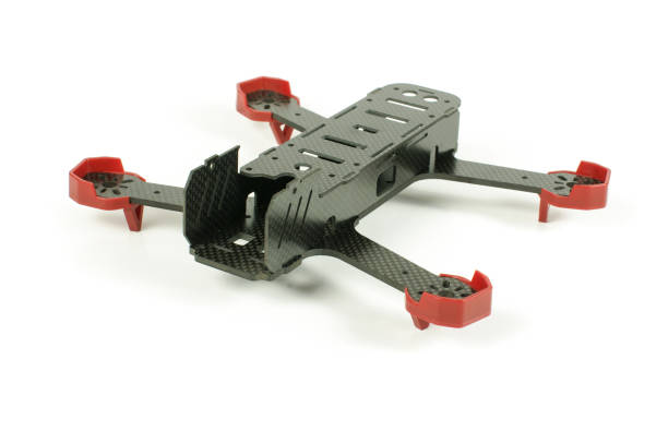 istock Carbon fiber racing drone frame isolated on the white background 957849794