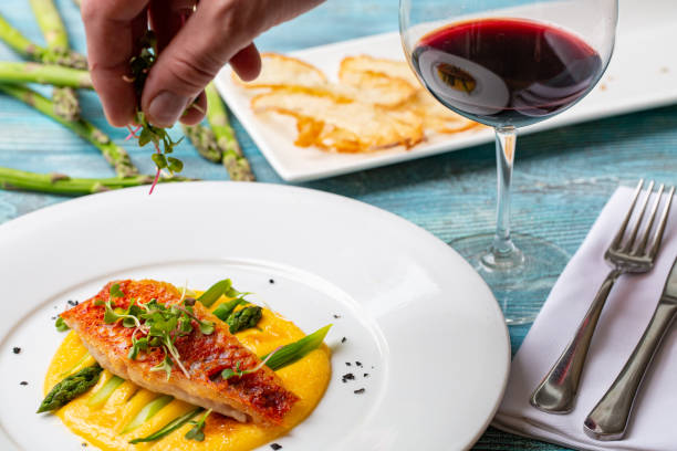 istock salmon on polenta with asparagus. restaurant feed. 957849992