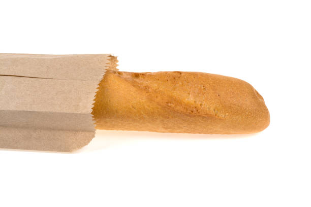 istock baguette in a paper bag on a white background 957860196