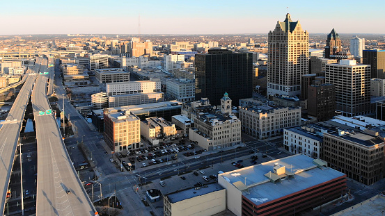 Aerial view of american city at dawn. High-rise  buildings, freeway, bay.  Sunny morning. Milwaukee, Wisconsin, USA