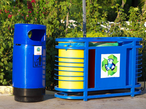 istock blue painted recycling bins in park 957874614