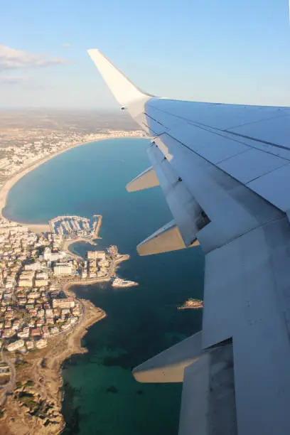 View of the Coast Through the Window of the Plane