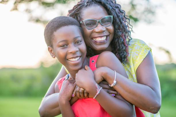 istock Mother and daughter hugging with joy 957878930