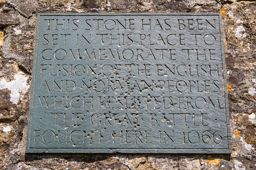 A plaque commemorating the fusion of the English and Norman people after the Battle of Hastings in 1066, located at Battle Abbey in East Sussex, UK.