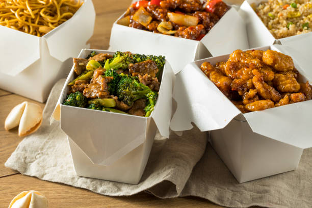 Spicy Chinese Take Out Food Spicy Chinese Take Out Food with Chopsticks and Fortune Cookies chinese cuisine fried rice asian cuisine wok stock pictures, royalty-free photos & images