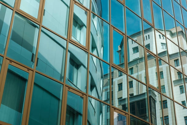 istock The modern building is reflected in the facade of another building 957883530