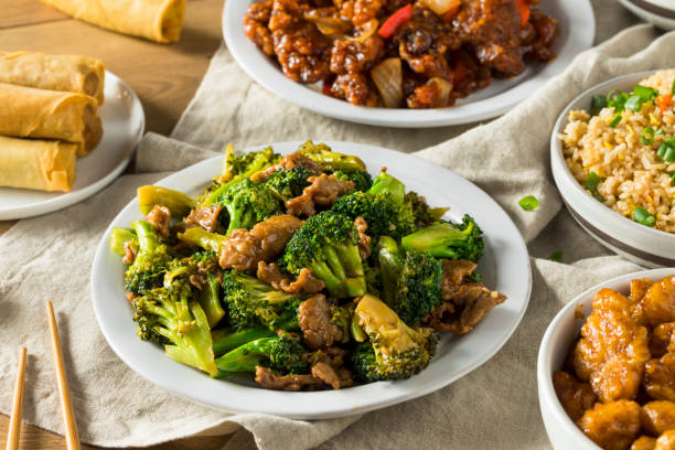 Spicy Chinese Take Out Food Spicy Chinese Take Out Food with Chopsticks and Fortune Cookies chinese cuisine fried rice asian cuisine wok stock pictures, royalty-free photos & images