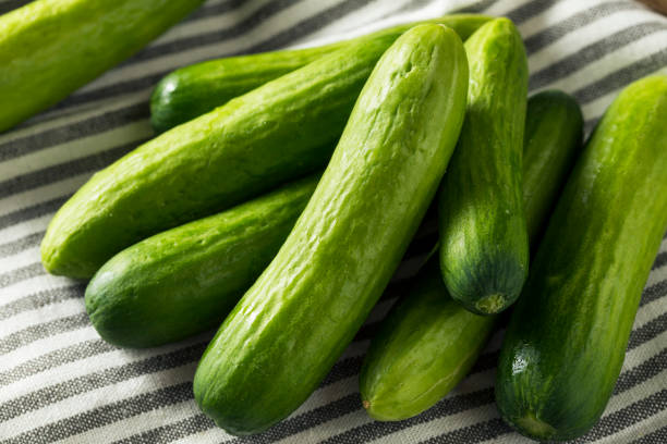 istock Raw Green Organic Baby Cucumbers 957888050