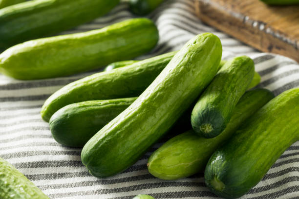istock Raw Green Organic Baby Cucumbers 957888246