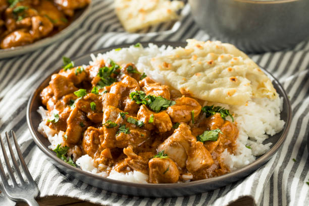 Homemade Indian Butter Chicken with Rice Homemade Indian Butter Chicken with Rice and Naan Bread chicken curry stock pictures, royalty-free photos & images