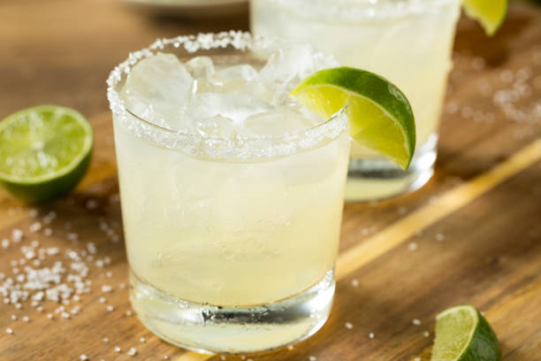 Alcoholic Lime Margarita with Tequila Alcoholic Lime Margarita with Tequila and Sea Salt tequila drink stock pictures, royalty-free photos & images