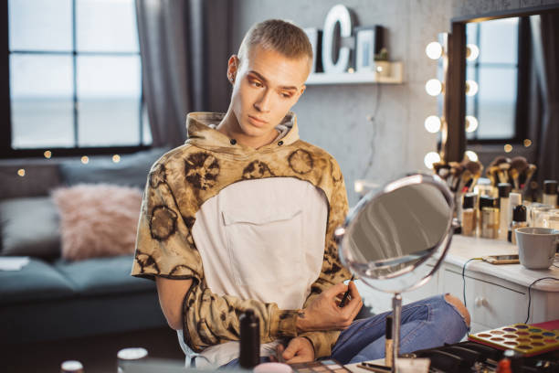 istock Young male makeup artist 957895834