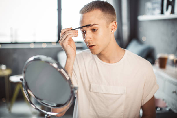 istock Young male makeup artist 957896302