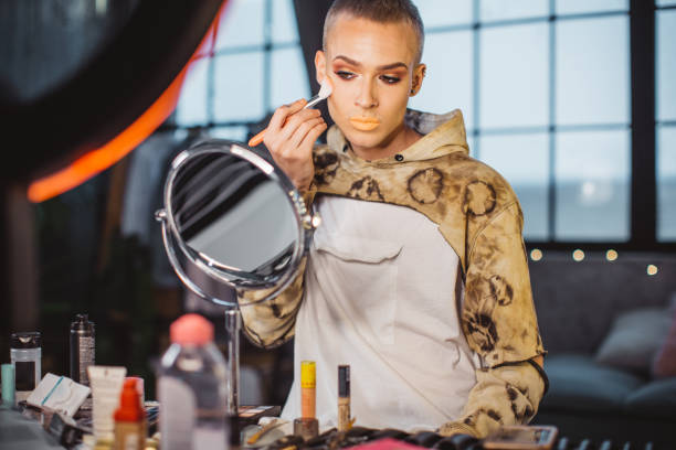 istock Young male makeup artist 957896400