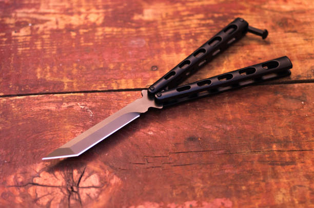 istock Butterfly knife. Knife balisong. 957900138