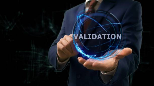 istock Businessman shows concept hologram Validation on his hand 957904882