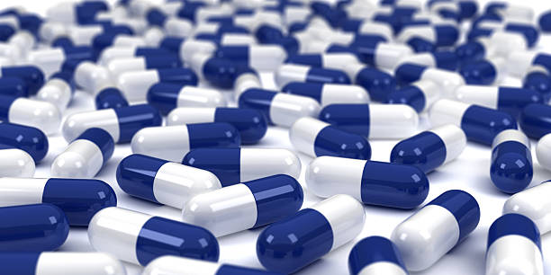 istock Myriad of White and Blue Pills on Surface 95790735