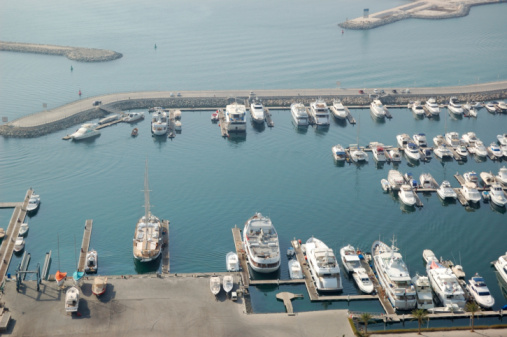 Aerial photo from a drone of a row of luxury super yachts moored in Port Vauban, Antibes, Cote D'Azur, France