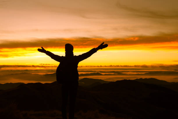 istock Woman hiker enjoying the view on mountain peak 957926646
