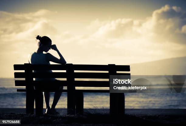 Lonely Woman Sitting Alone On A Bench Stock Photo - Download Image Now - Sadness, Summer, Depression - Sadness