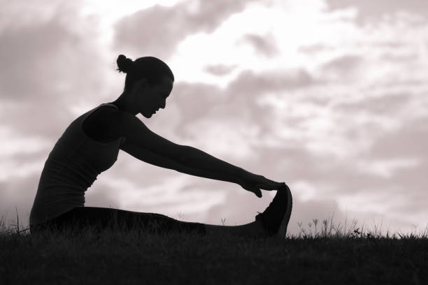 istock Woman stretching outdoors 957927014