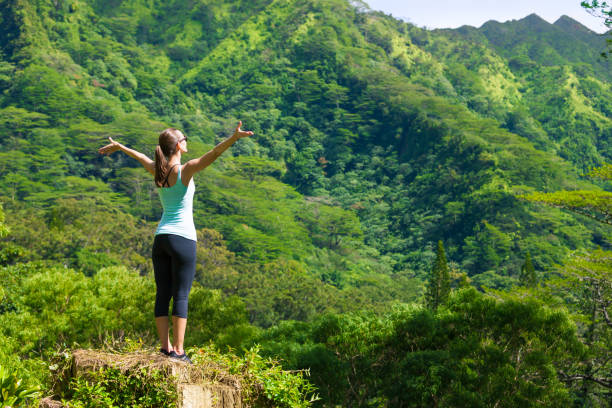 istock Happy woman in a beautiful nature setting. 957927306