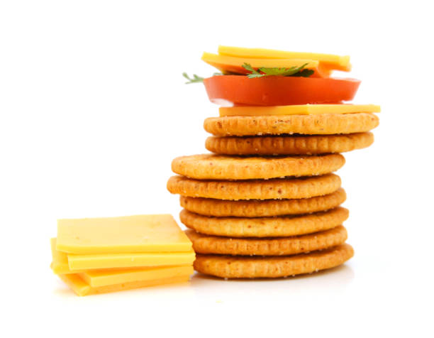 istock Delicious crackers with cheese on white background 957947928