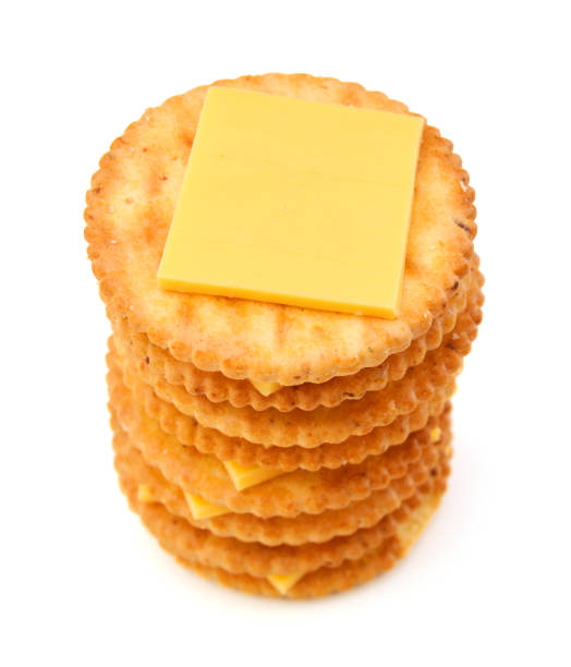 istock Delicious crackers with cheese on white background 957947966