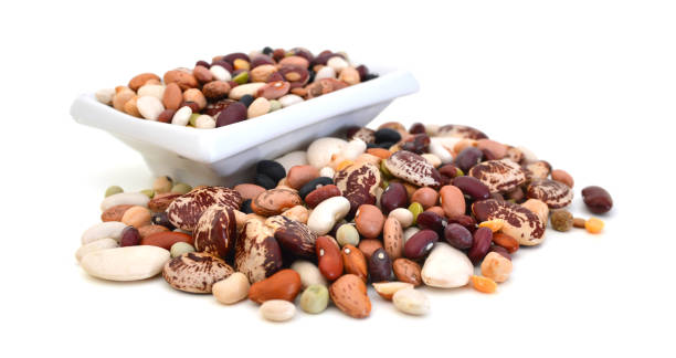 istock A mixture of legumes in an earthenware bowl, white background. 957948454