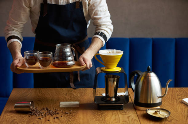 istock Barista making coffee at counter bar,close-up 957951228