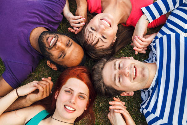 istock Group Of Friends Spending Time Together In Park 957951446
