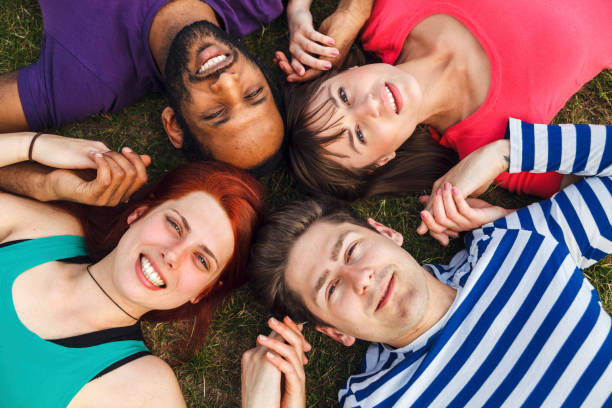 istock Group Of Friends Spending Time Together In Park 957951448