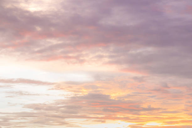 istock Dramatic sunset and sunrise sky with beautiful and colorful nice soft cloud background concept. 957951538