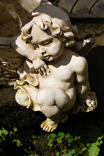istock Angel sculpture in garden 95795543