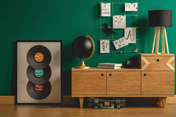 istock Green bag under retro dresser 957956264