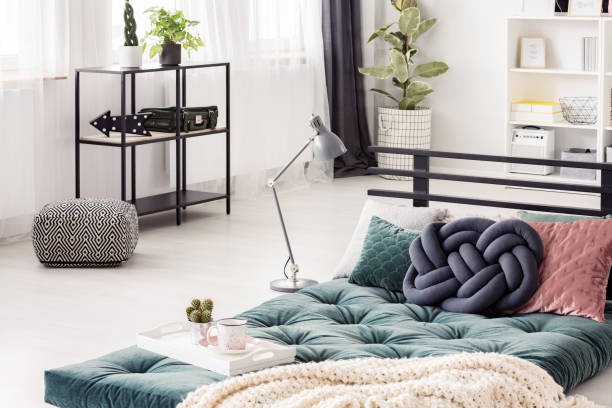 istock Green futon in bedroom interior 957956286