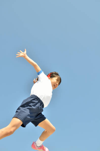 Girl's jumping in the blue sky