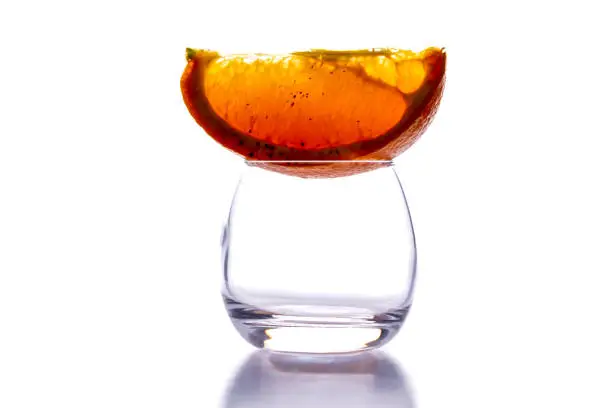 fresh sweet orange slice with cinnamon on a glass