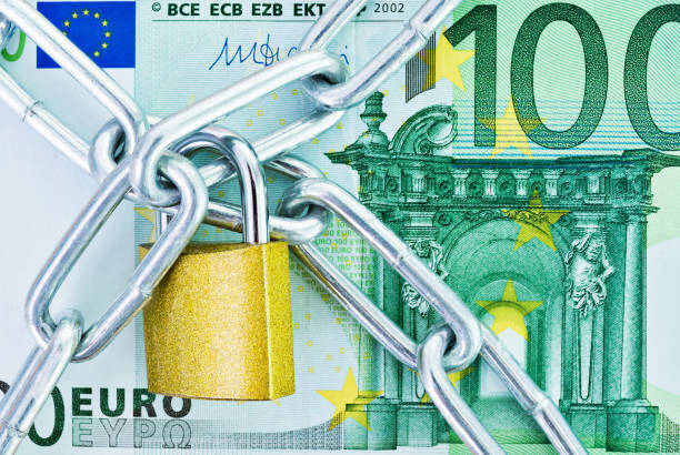 European currency with a chain and lock.