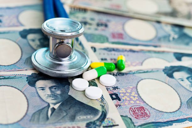 istock Stethoscope and pills on Japanese currency 957982962