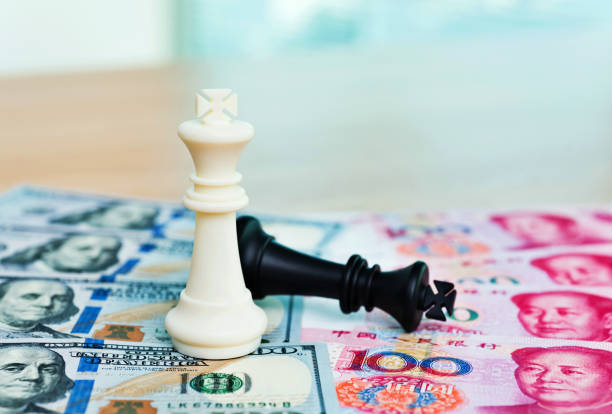 istock Chess pieces and paper currency 957983376
