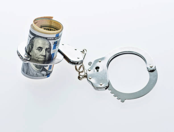 istock US dollar bills in handcuffs 957983762