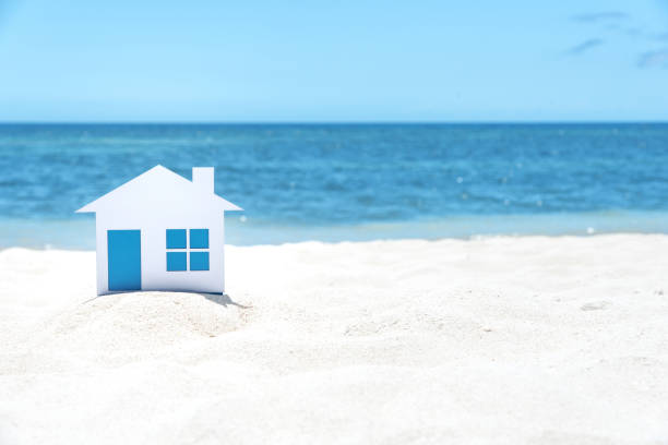 istock Small House On The White Sandy Beach 957986616