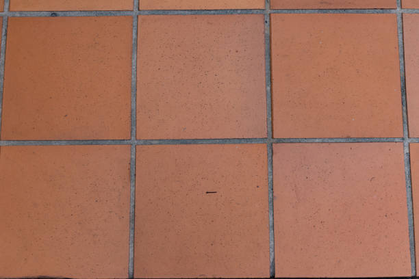 istock Texture - orange square tiles flooring 957987138