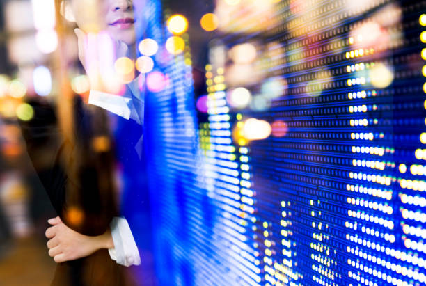 istock Multiple exposure of businesswoman analyzing stock market data 957987324