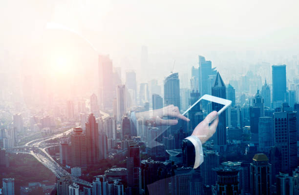 istock Multiple exposure of businesswoman touching digital tablet 957987548
