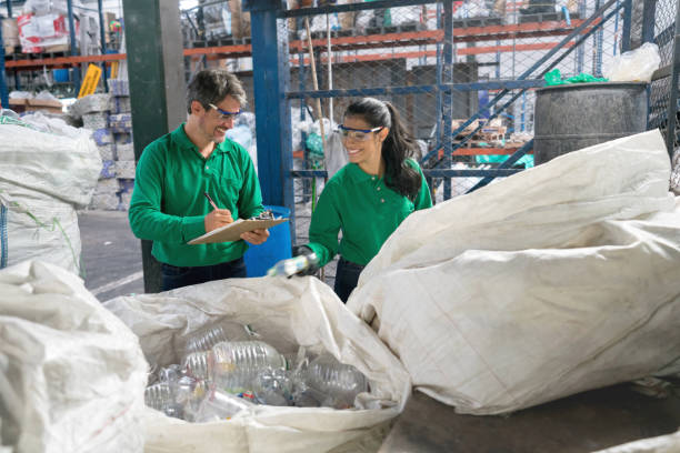 istock People working in a recycling factory 957987710