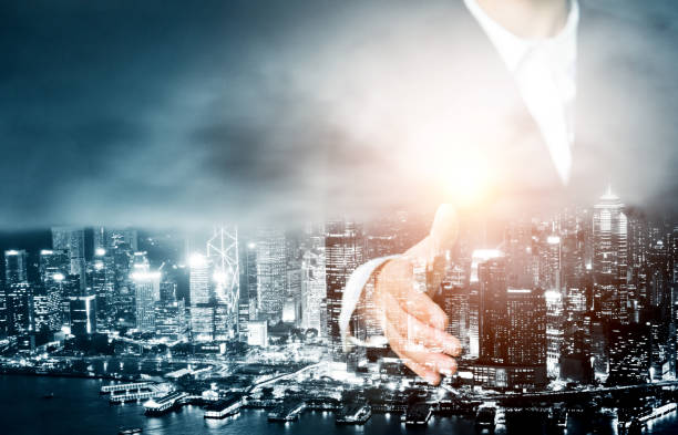 istock Multiple exposure of businesswoman handshake 957990362