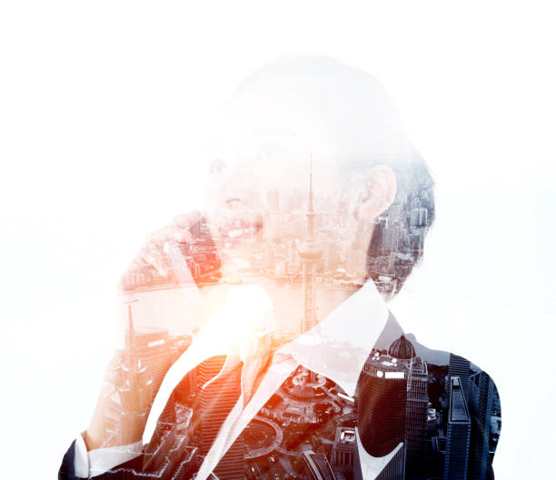 istock Multiple exposure of businesswoman using mobile phone 957990422