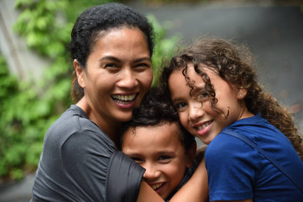 istock Mother and children having fun 957990504